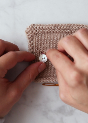 Sewing a Button onto Knitwear | Purl Soho